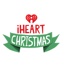 iheart Christmas classics playlist playing with festive decorations, Christmas tree lights, and cozy holiday atmosphere