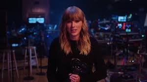 Taylor Swift receiving Artist of the Year at iHeartRadio Music Awards 2026 on stage